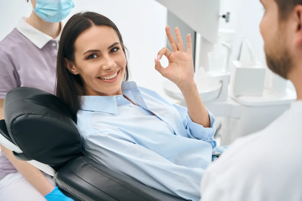 positive woman client enjoying good Orthodontics service At Sequence Orthodontics